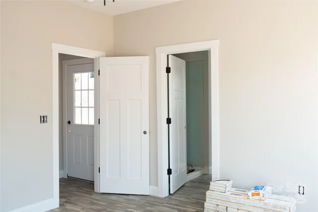 a view of an entryway with wooden floor