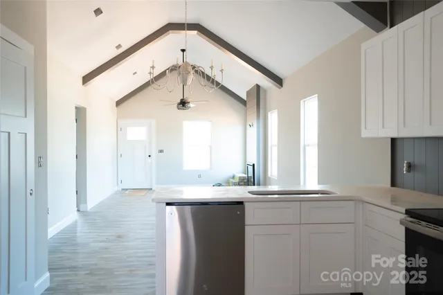 a bathroom with a sink a mirror and a shower