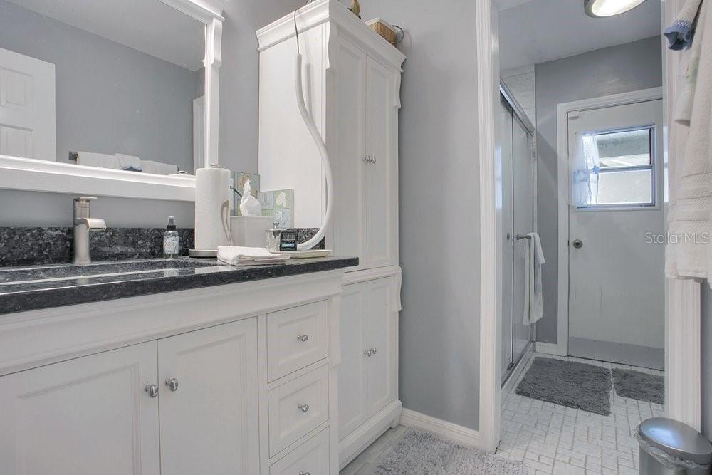 412 Forest Street Windermere, FL 34786 - Photo 16 of 34 a bathroom with a sink and a mirror