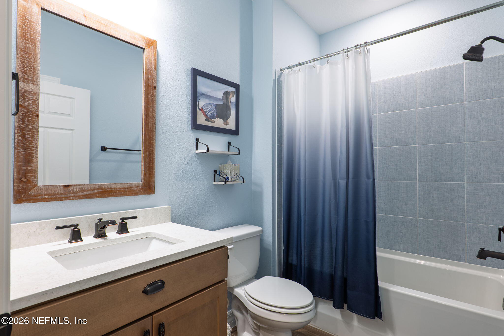 408 Del Webb Parkway Yulee, FL 32097 - Photo 11 of 29 a bathroom with a sink a toilet a mirror and shower