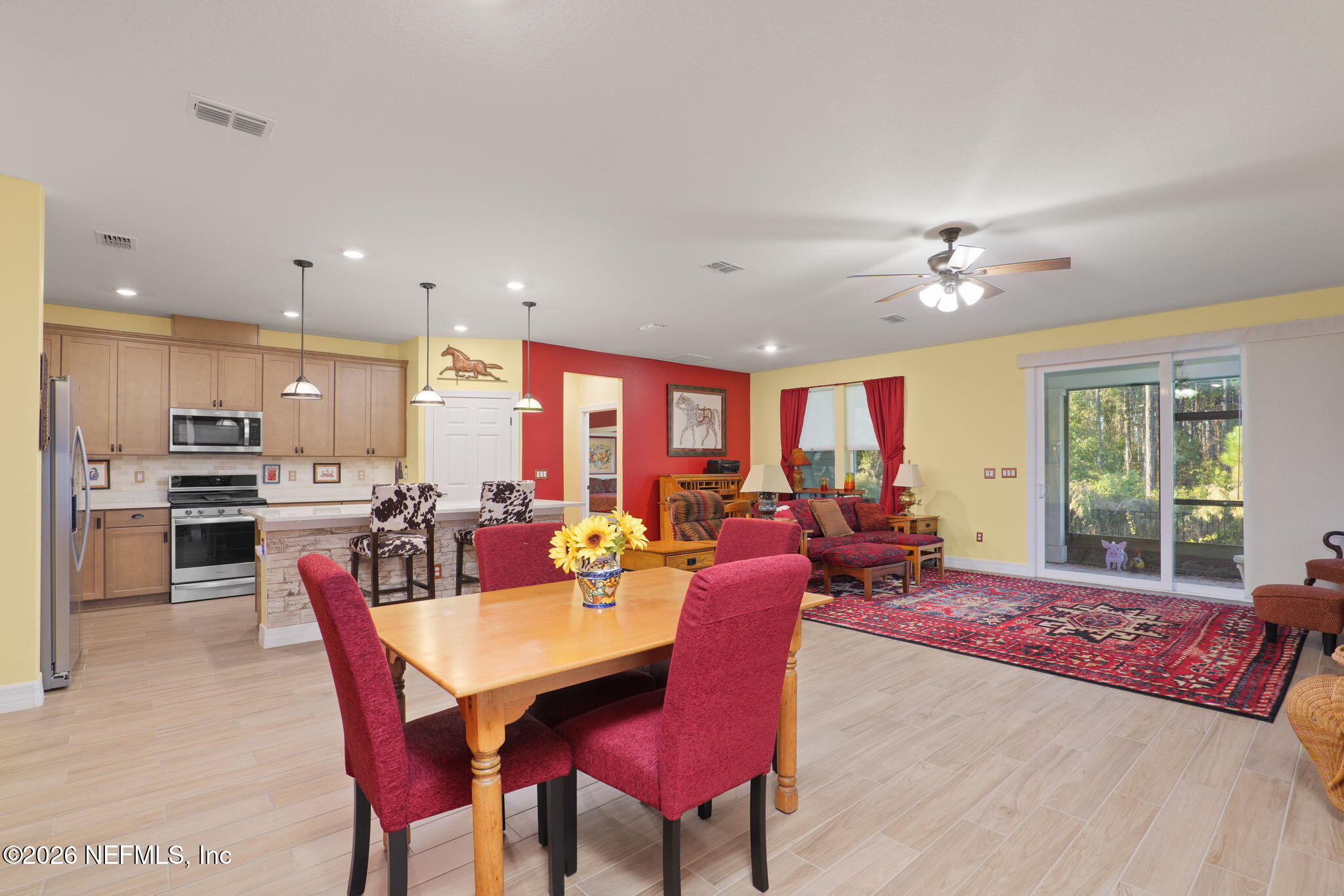 408 Del Webb Parkway Yulee, FL 32097 - Photo 14 of 35 a view of a dining room with furniture
