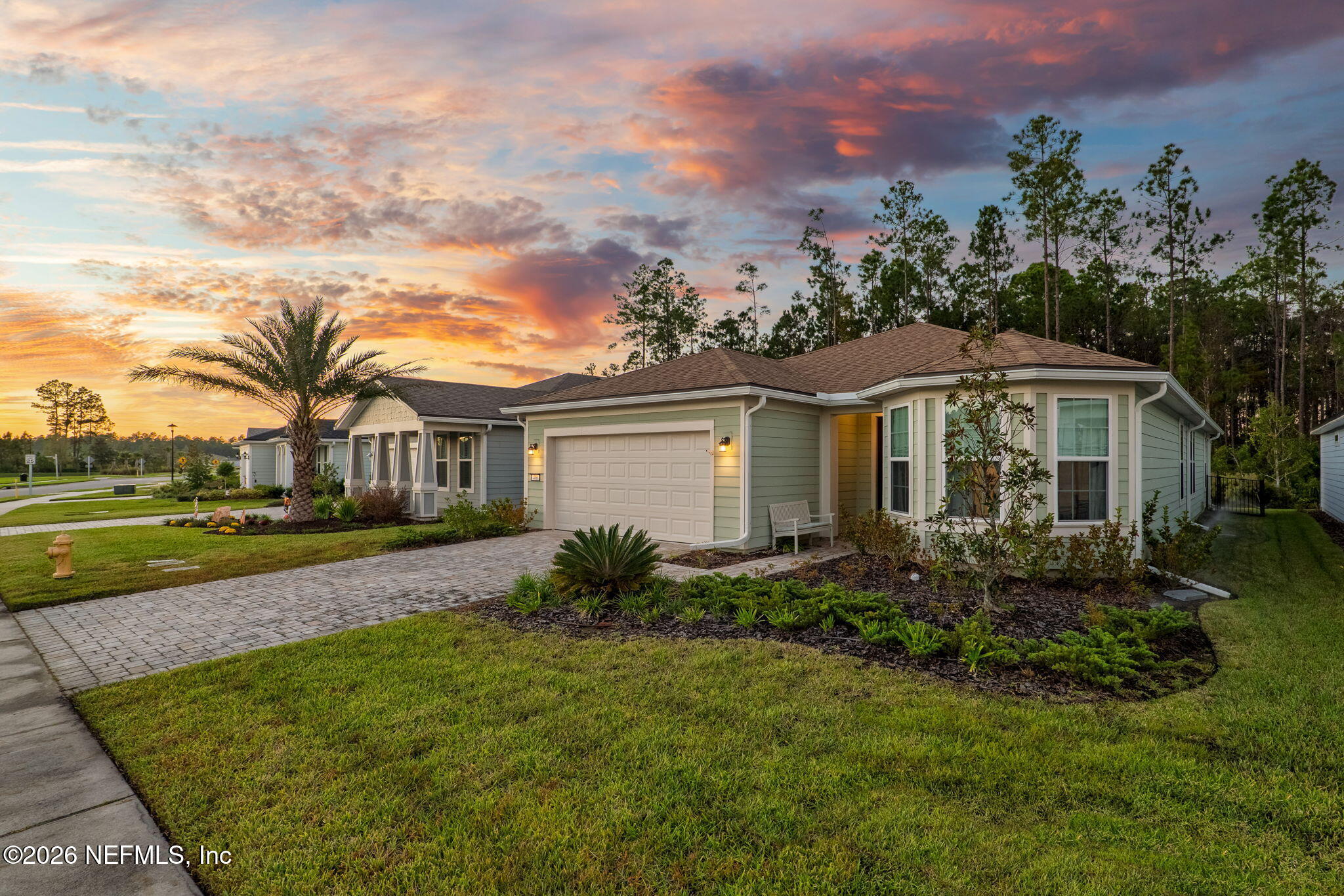 408 Del Webb Parkway Yulee, FL 32097 - Photo 25 of 35 a front view of a house with garden