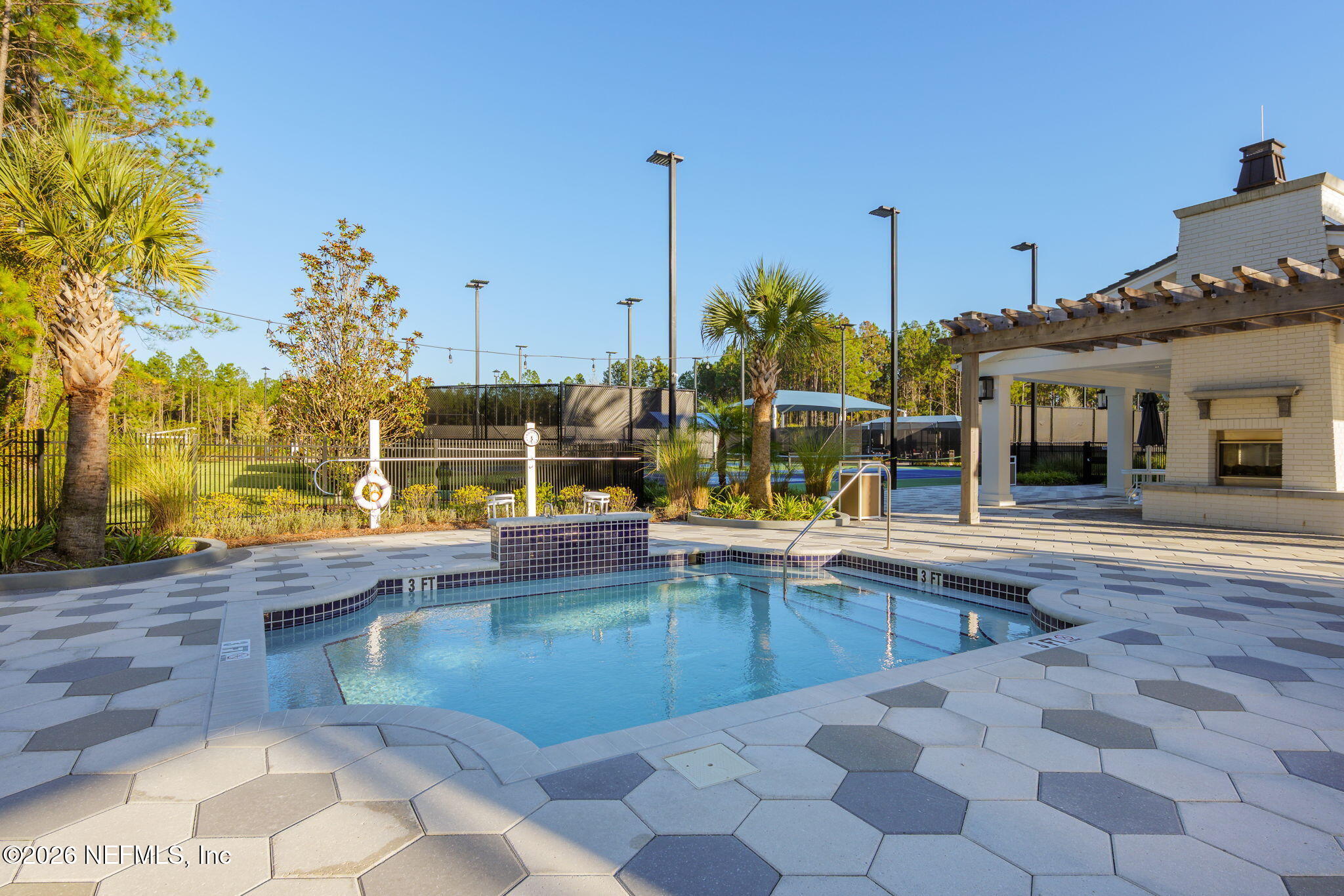 408 Del Webb Parkway Yulee, FL 32097 - Photo 30 of 35 a view of a swimming pool with a lounge chairs
