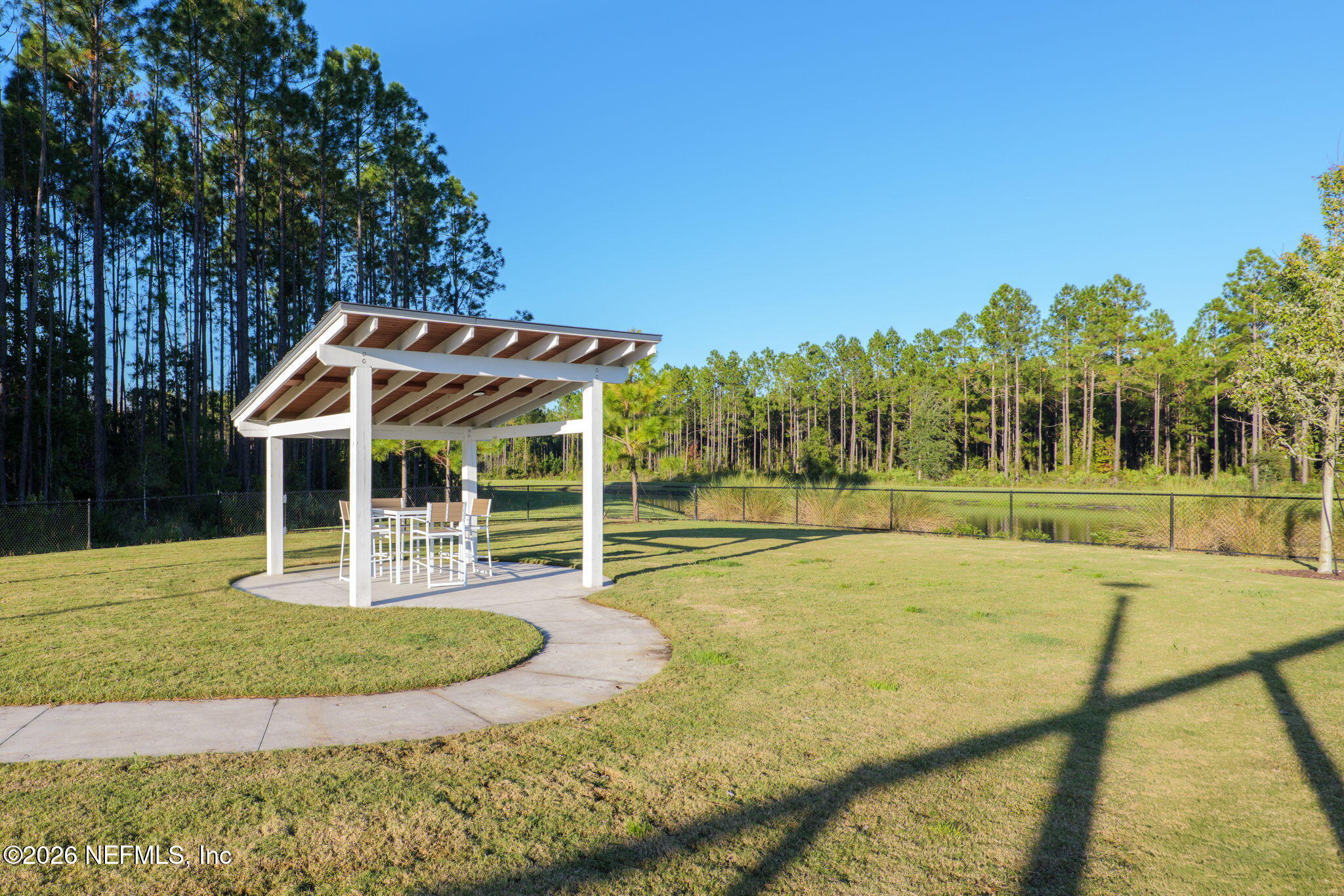 408 Del Webb Parkway Yulee, FL 32097 - Photo 33 of 35 a view of a house with swimming pool and sitting area