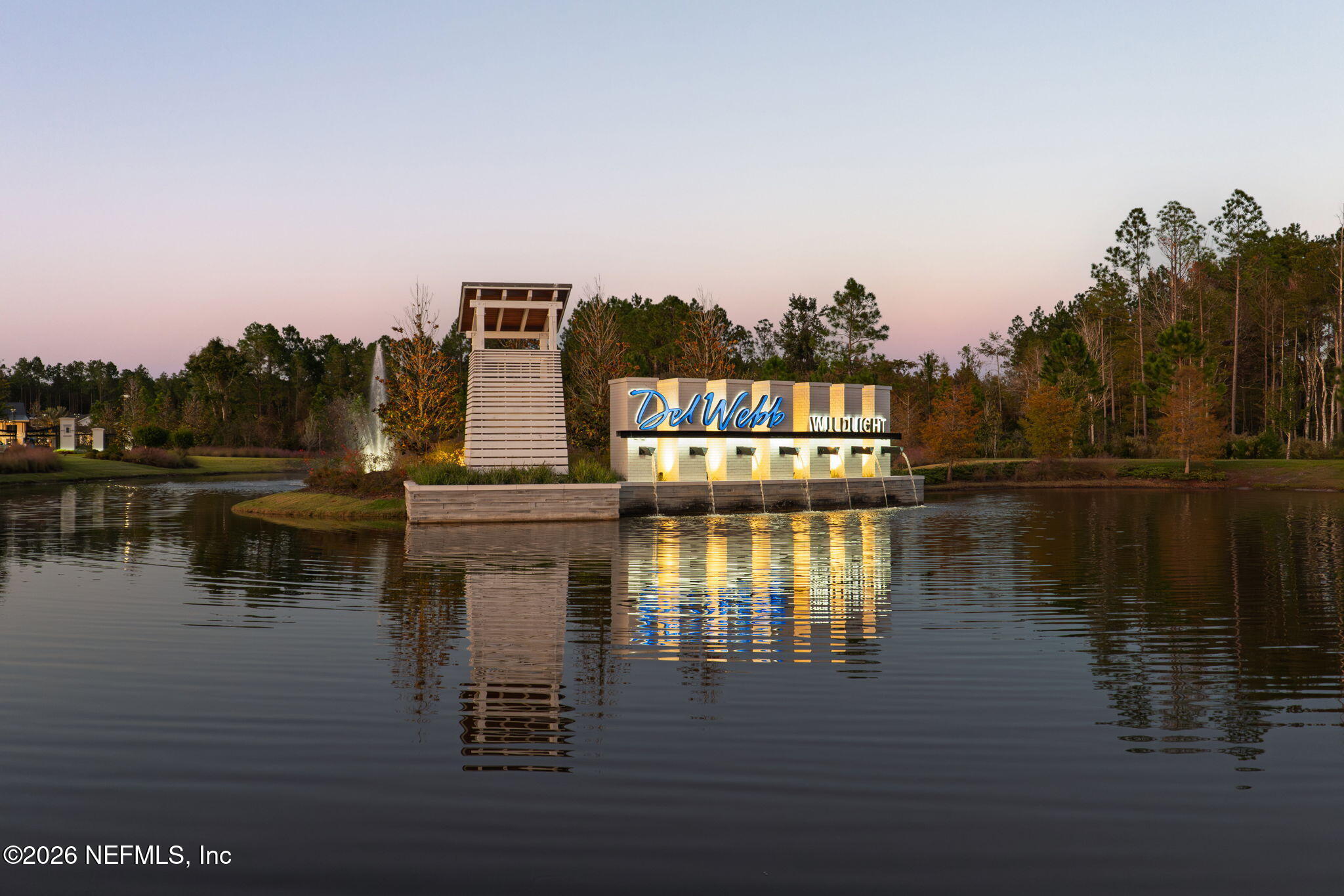 408 Del Webb Parkway Yulee, FL 32097 - Photo 35 of 35 a view of a lake with building in front of it