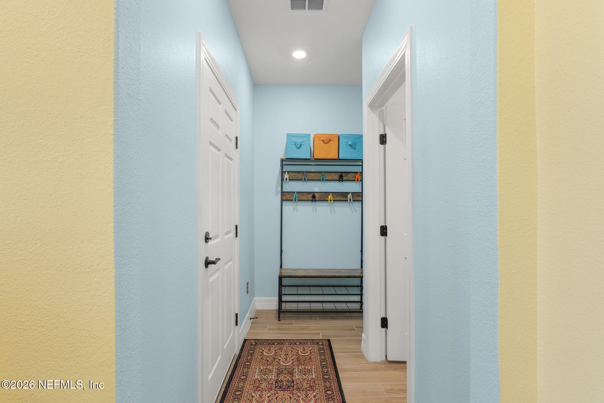 408 Del Webb Parkway Yulee, FL 32097 - Photo 9 of 35 a view of a hallway with wooden shelves