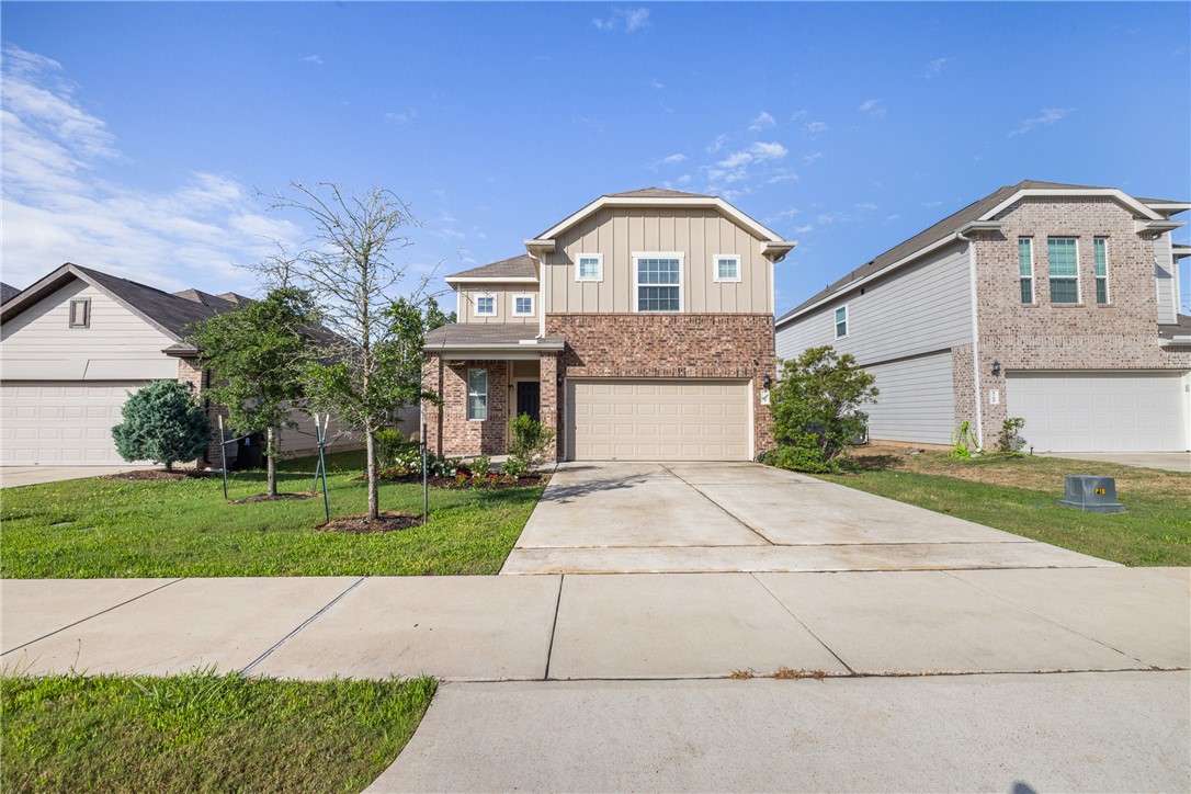 4702 Nopalitos Way Bryan, TX 77807 - Photo 3 of 27 a front view of a house with a yard