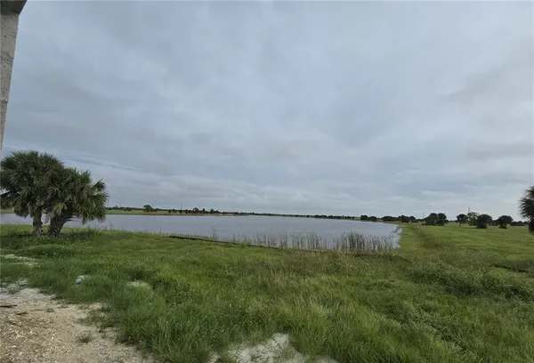 a view of a lake with a big yard