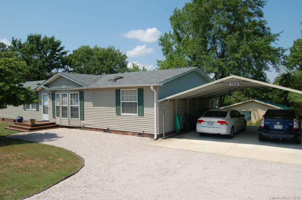 1880 Flat Rock Road York, SC 29745 - Photo 22 of 23 a view of a car parked in front of a house