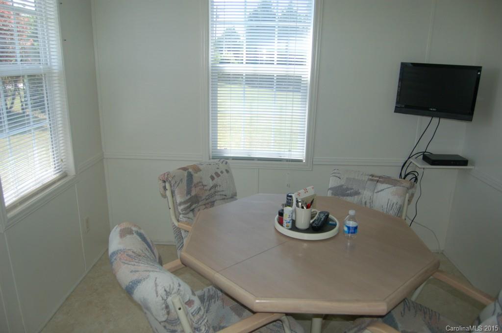 1880 Flat Rock Road York, SC 29745 - Photo 6 of 23 a view of a dining room with a table and chairs