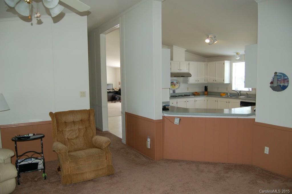 1880 Flat Rock Road York, SC 29745 - Photo 9 of 23 a living room with stainless steel appliances granite countertop furniture and a couch
