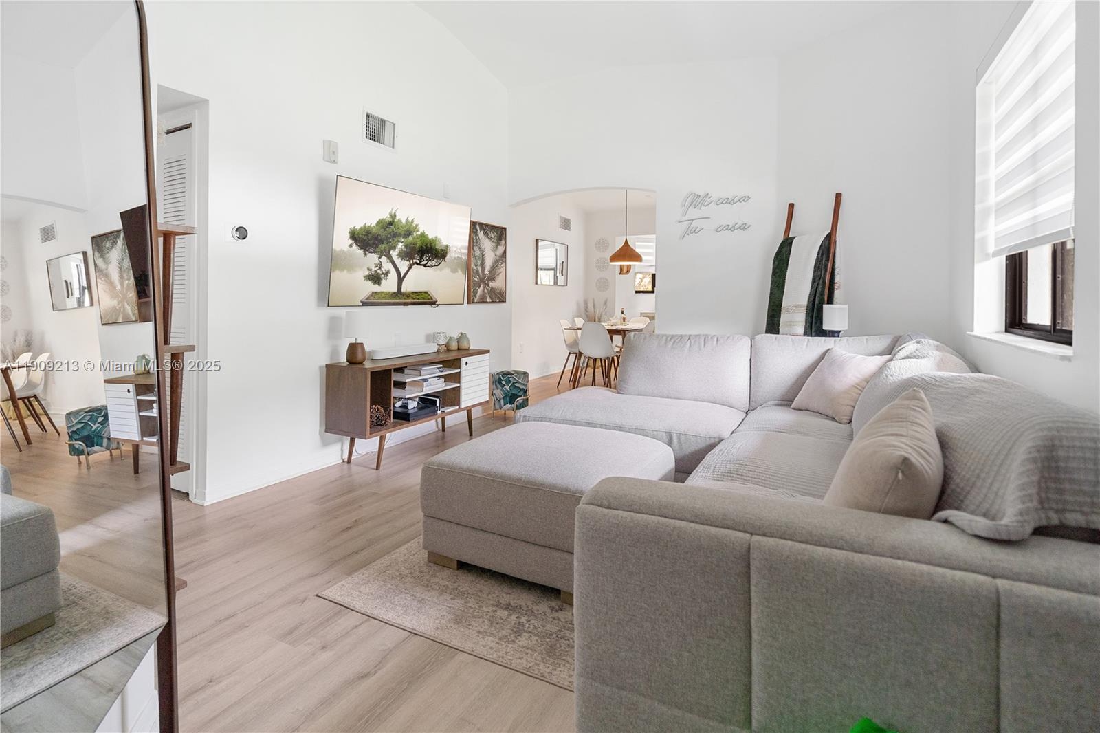 a living room with furniture and a table