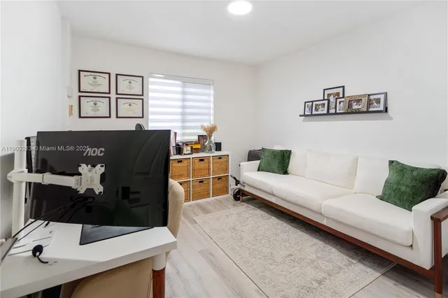 a living room with furniture and window