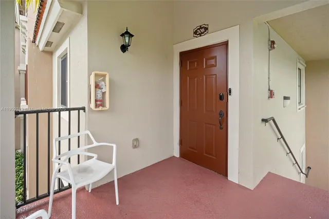 a view of a hallway with seating area