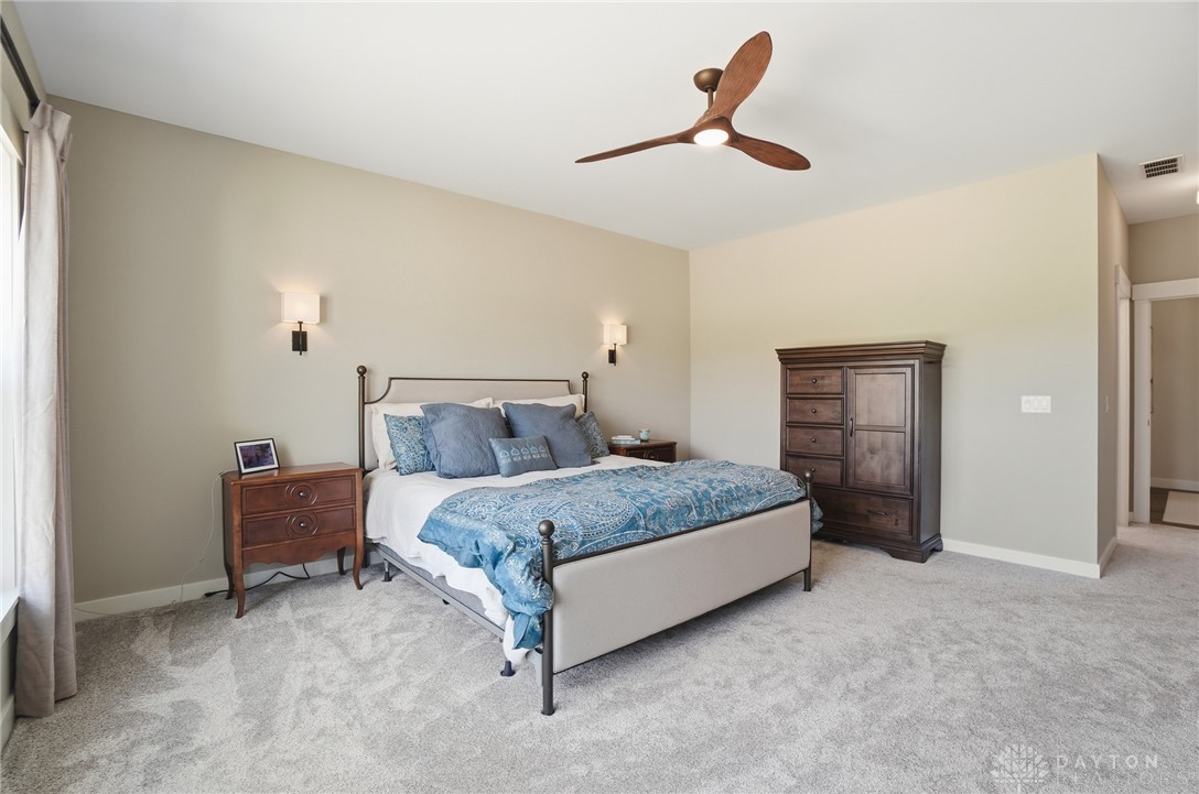 9364 Kenrick Road Dayton, OH 45458 - Photo 21 of 62 This spacious bedroom offers a tranquil retreat with plush carpeting and natural light.