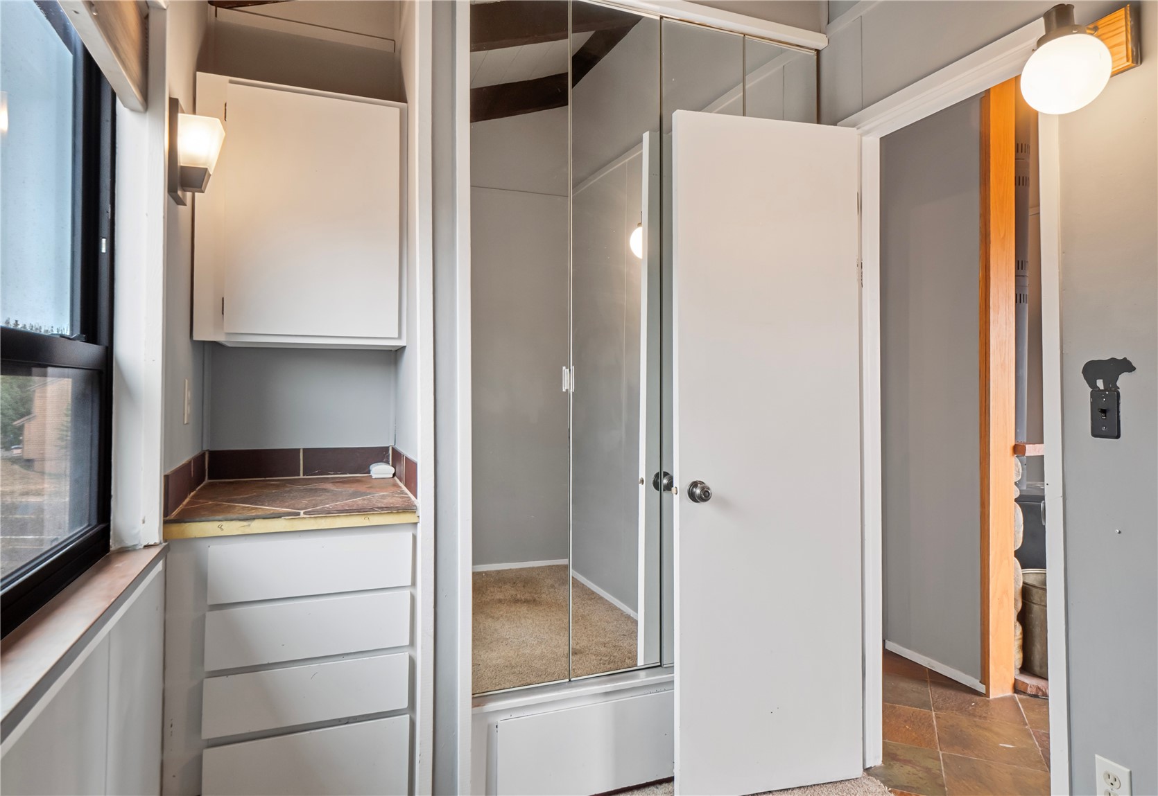 809 Ryan Gulch Road, Unit 809 Silverthorne, CO 80498 - Photo 12 of 18 a kitchen with a refrigerator and cabinets