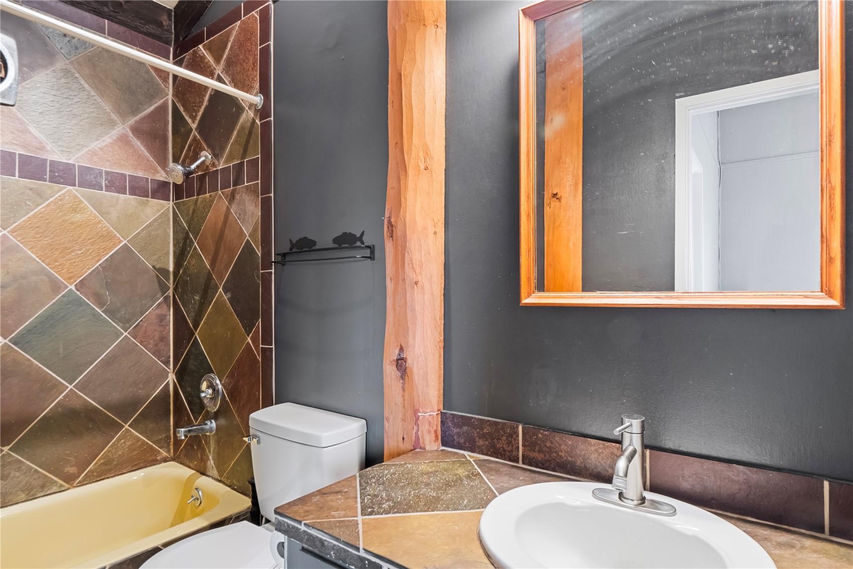809 Ryan Gulch Road, Unit 809 Silverthorne, CO 80498 - Photo 13 of 18 a bathroom with a sink and a mirror