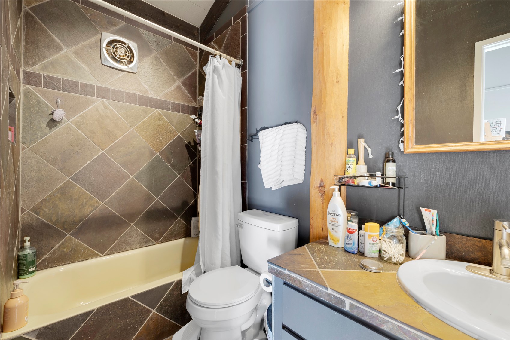 809 Ryan Gulch Road, Unit 809 Silverthorne, CO 80498 - Photo 14 of 17 Full bath with vanity and shower / bath combo with shower curtain