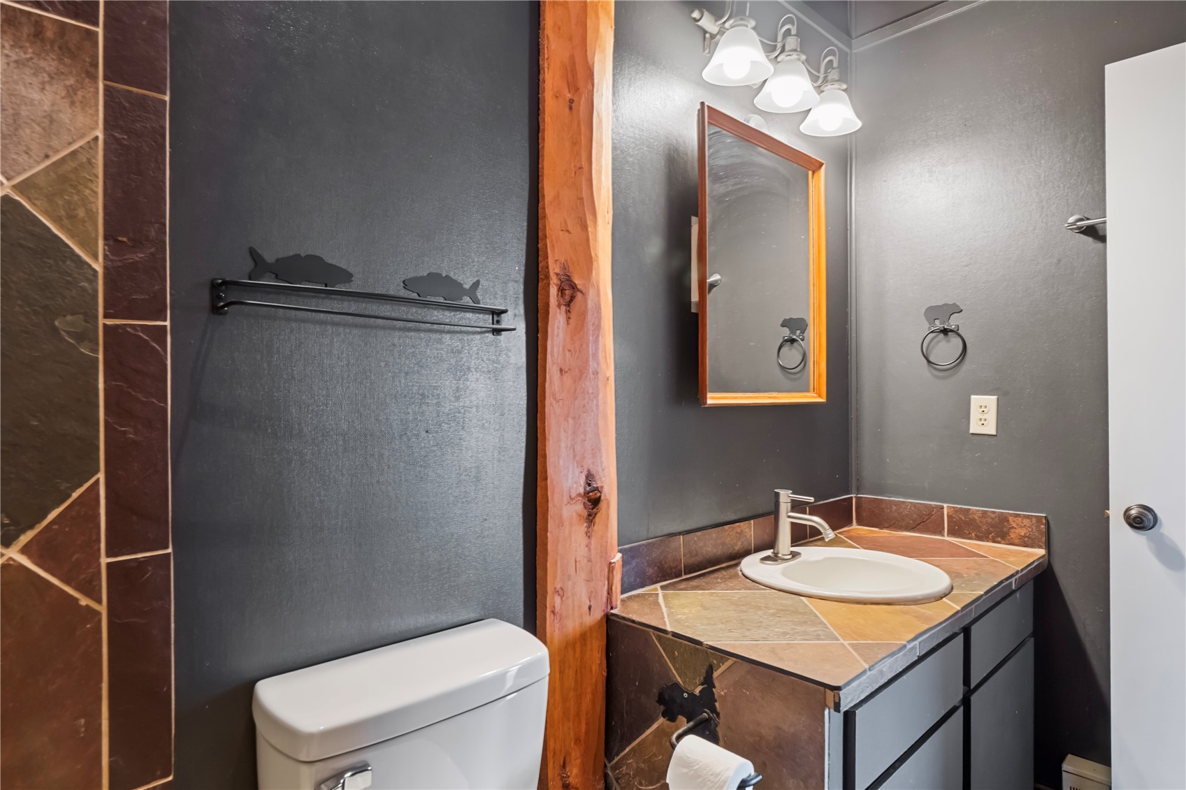 809 Ryan Gulch Road, Unit 809 Silverthorne, CO 80498 - Photo 14 of 18 a bathroom with a sink toilet vanity and shower