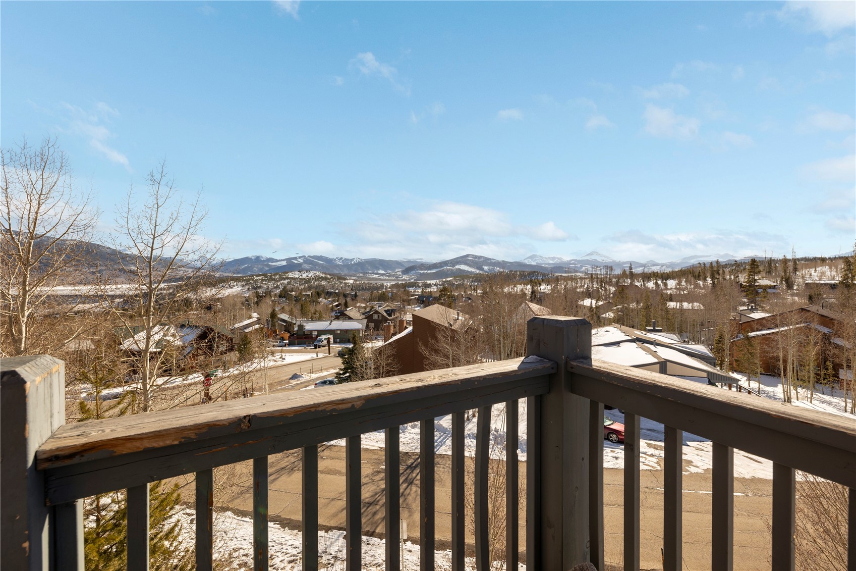 809 Ryan Gulch Road, Unit 809 Silverthorne, CO 80498 - Photo 2 of 17 Snow covered back of property with a mountain view