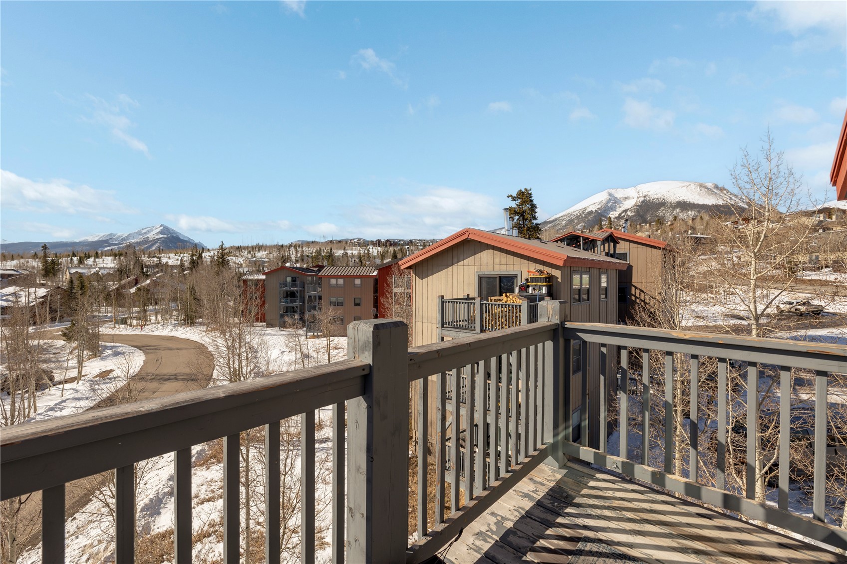 809 Ryan Gulch Road, Unit 809 Silverthorne, CO 80498 - Photo 3 of 17 Snow covered deck with a mountain view and a balcony