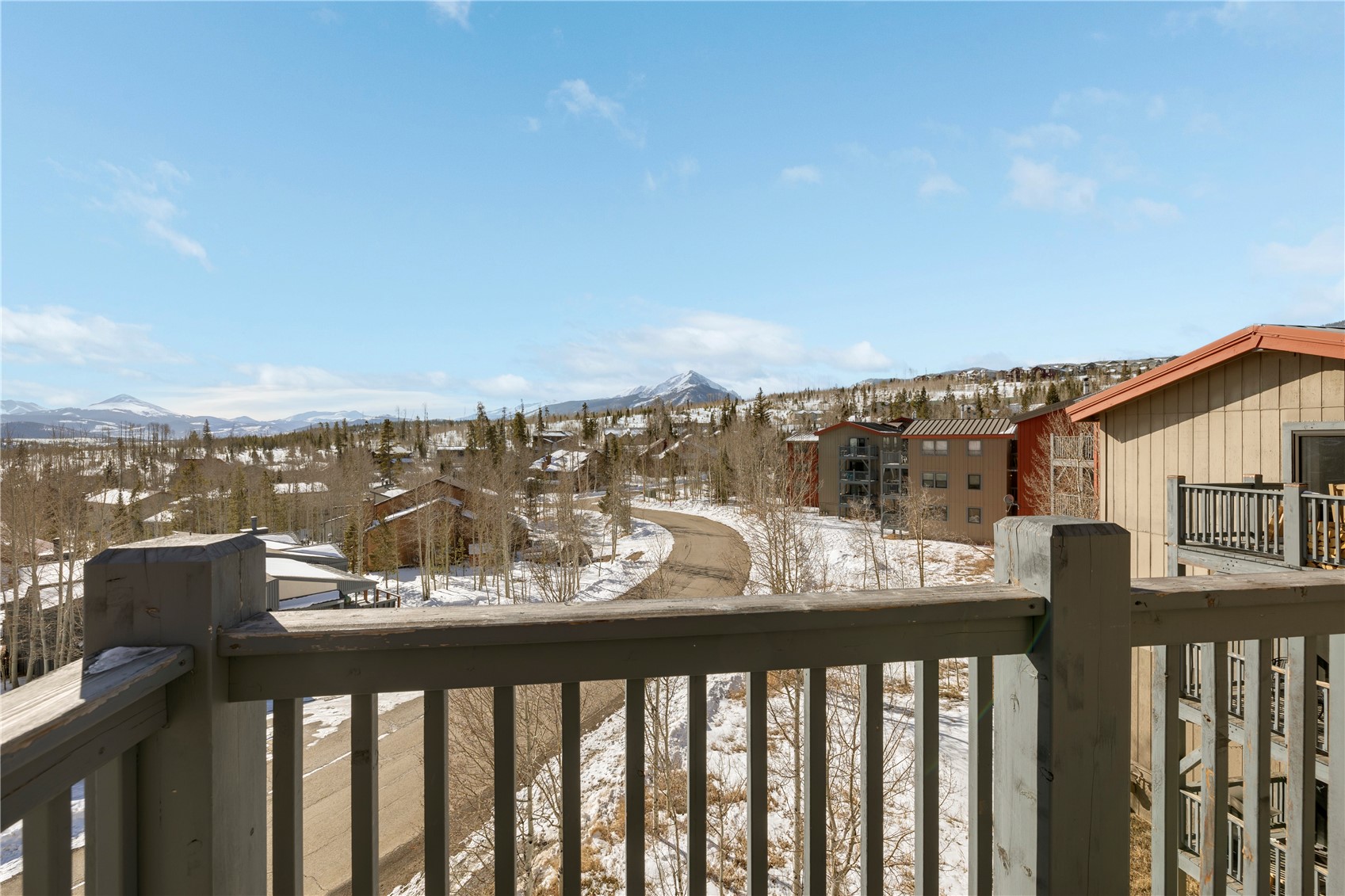 809 Ryan Gulch Road, Unit 809 Silverthorne, CO 80498 - Photo 4 of 17 Snow covered back of property with a mountain view