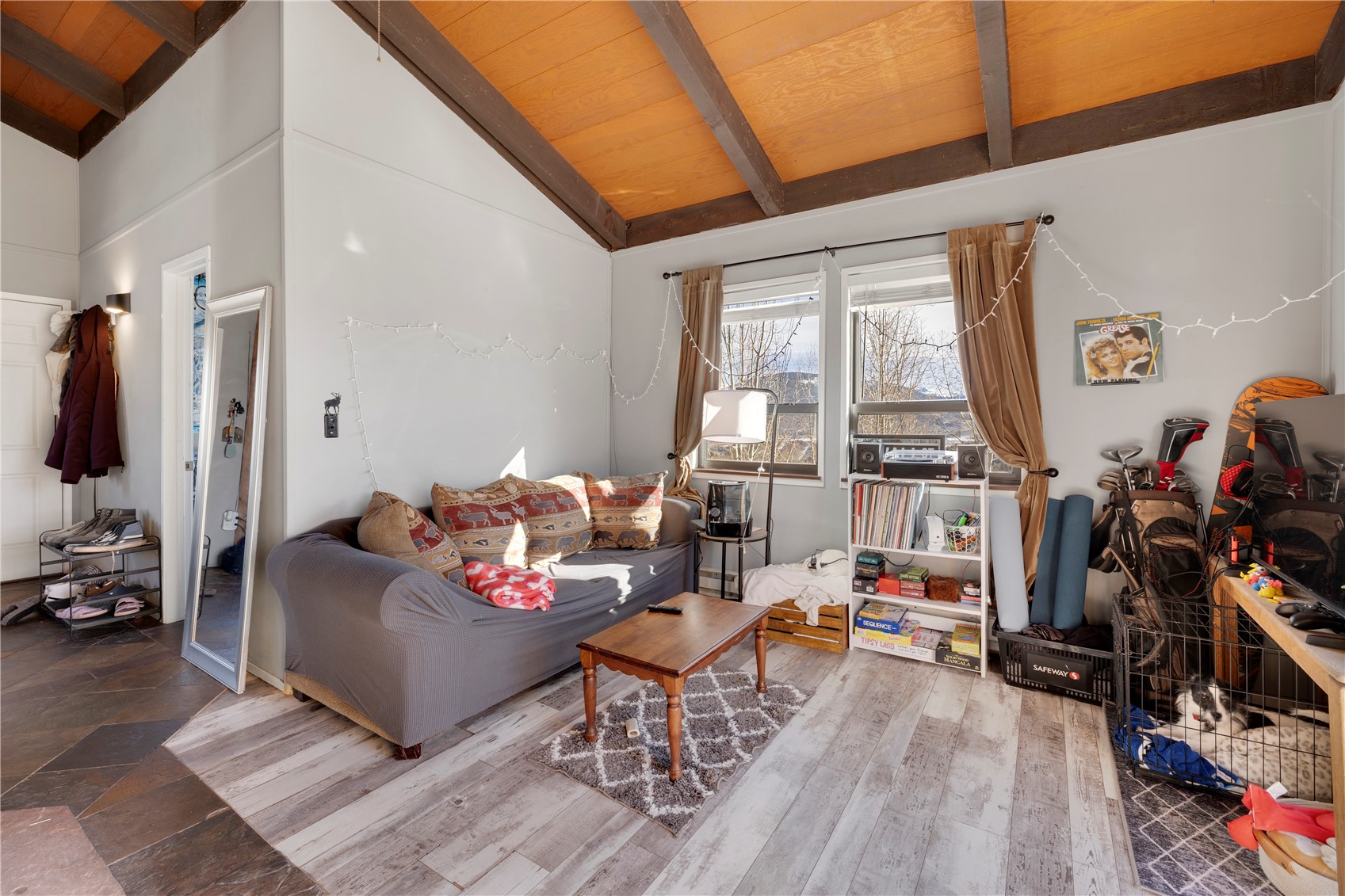 809 Ryan Gulch Road, Unit 809 Silverthorne, CO 80498 - Photo 6 of 17 Living area with lofted ceiling with beams and wooden ceiling