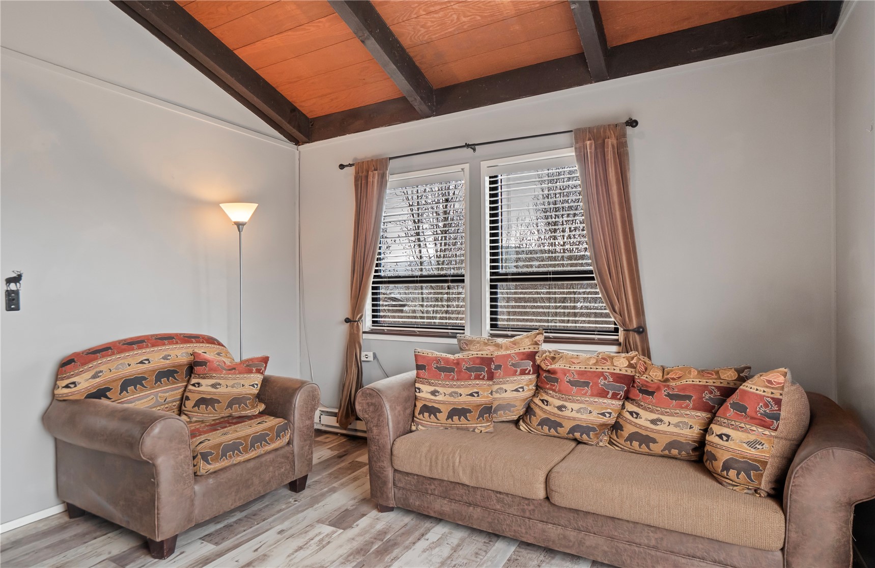 809 Ryan Gulch Road, Unit 809 Silverthorne, CO 80498 - Photo 7 of 18 a bedroom with furniture and a window