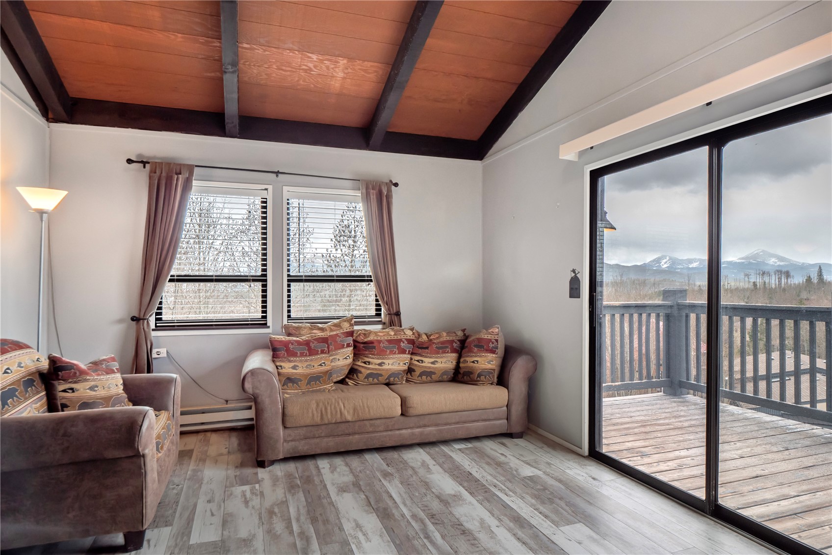809 Ryan Gulch Road, Unit 809 Silverthorne, CO 80498 - Photo 9 of 18 a living room with furniture and a large window