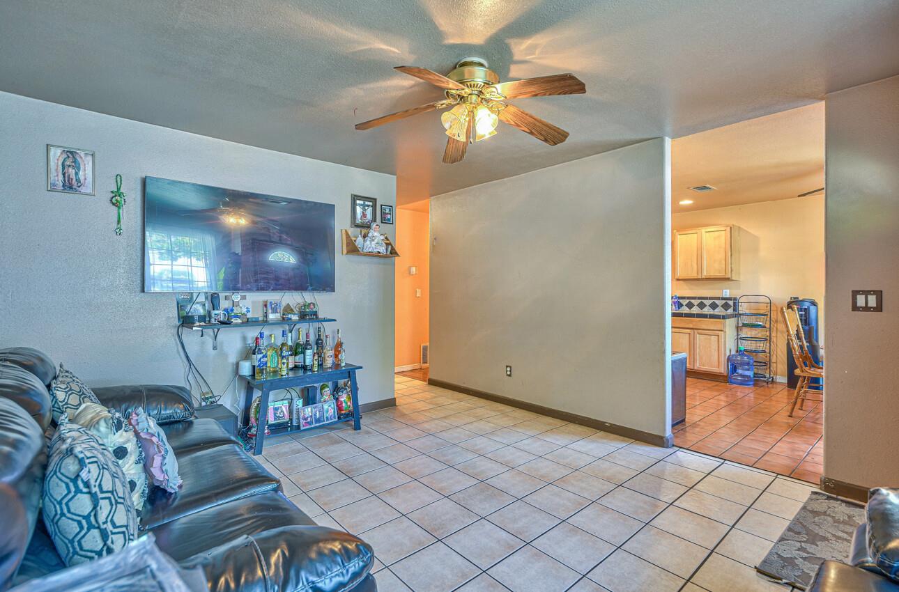 415 Michael Circle Gonzales, CA 93926 - Photo 4 of 16 a living room with furniture and a chandelier