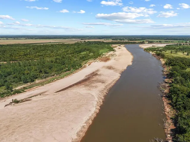 a view of an ocean beach and city