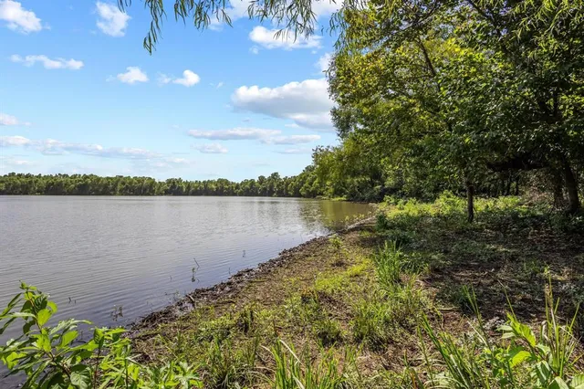 a view of a lake with a city