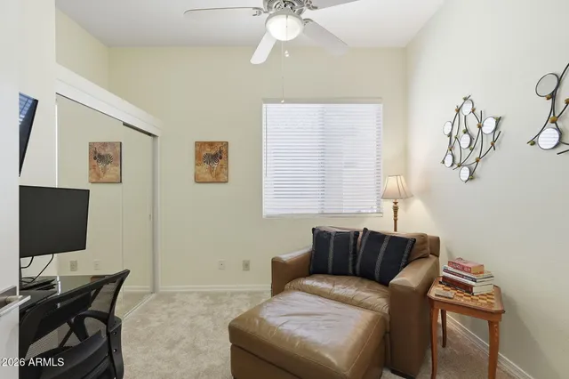a view of a backyard with plants and a patio