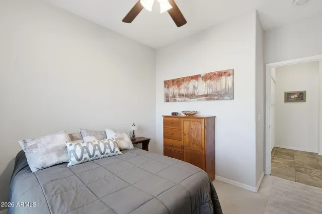 a view of a swimming pool with a lounge chair and a fire pit