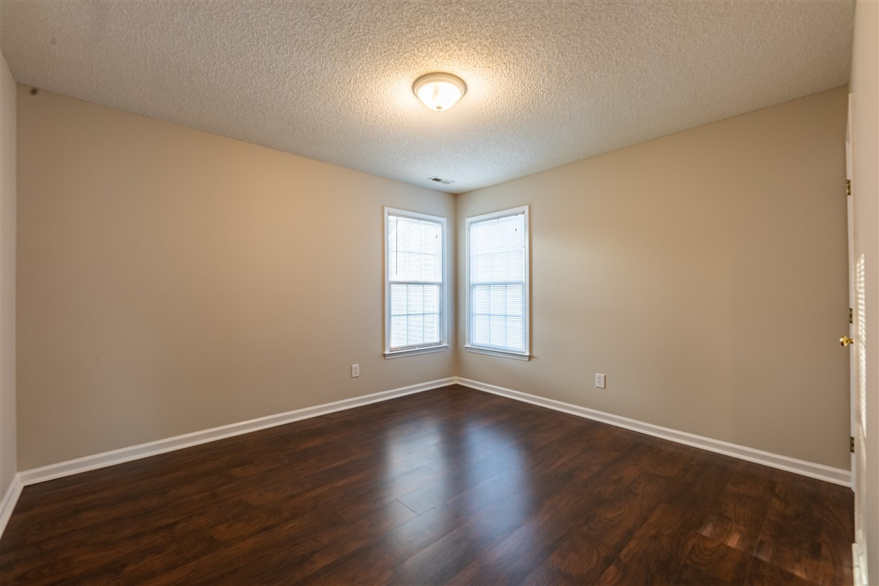 9212 Zermatt Court Raleigh, NC 27617 - Photo 16 of 30 The second bedroom features LVP flooring. Bedroom 2
