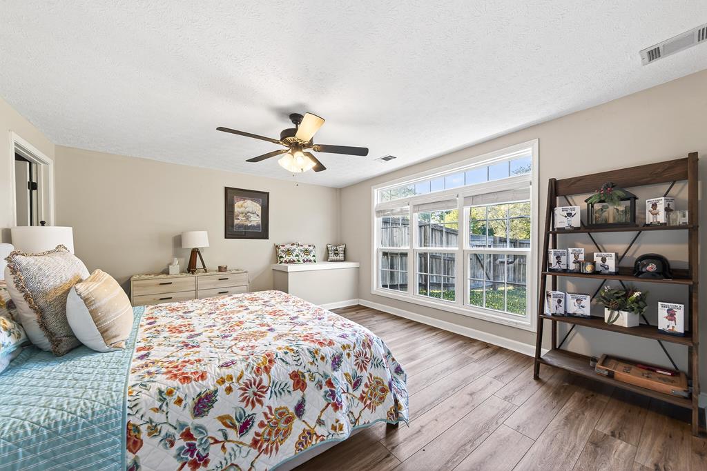 7333 Cedar Creek Loop Columbus, GA 31904 - Photo 35 of 37 a bedroom with a bed and a large window