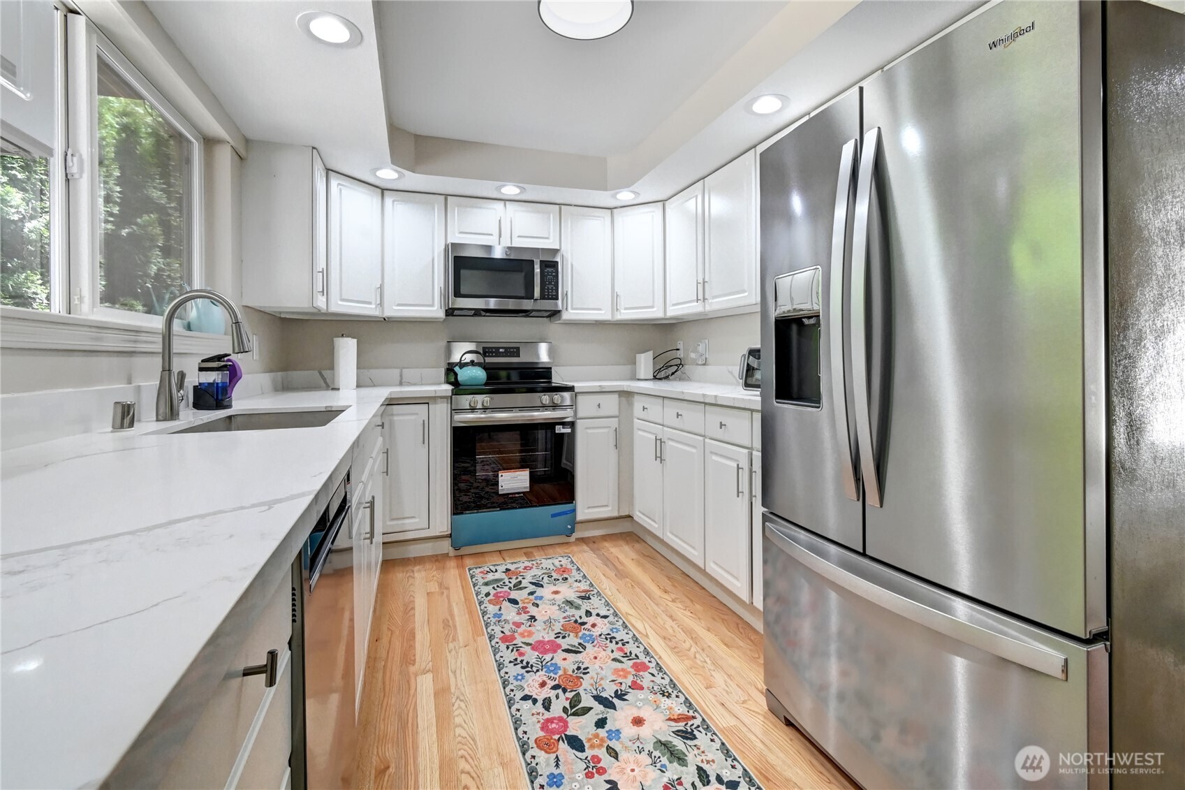 28539 Northeast Tolt Hill Road Carnation, WA 98014 - Photo 6 of 36 a kitchen with stainless steel appliances granite countertop a refrigerator sink and stove