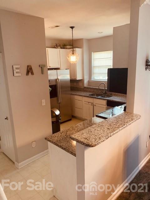 919 Azurine Circle Fort Mill, SC 29708 - Photo 8 of 19 a kitchen with stainless steel appliances granite countertop a refrigerator and a sink