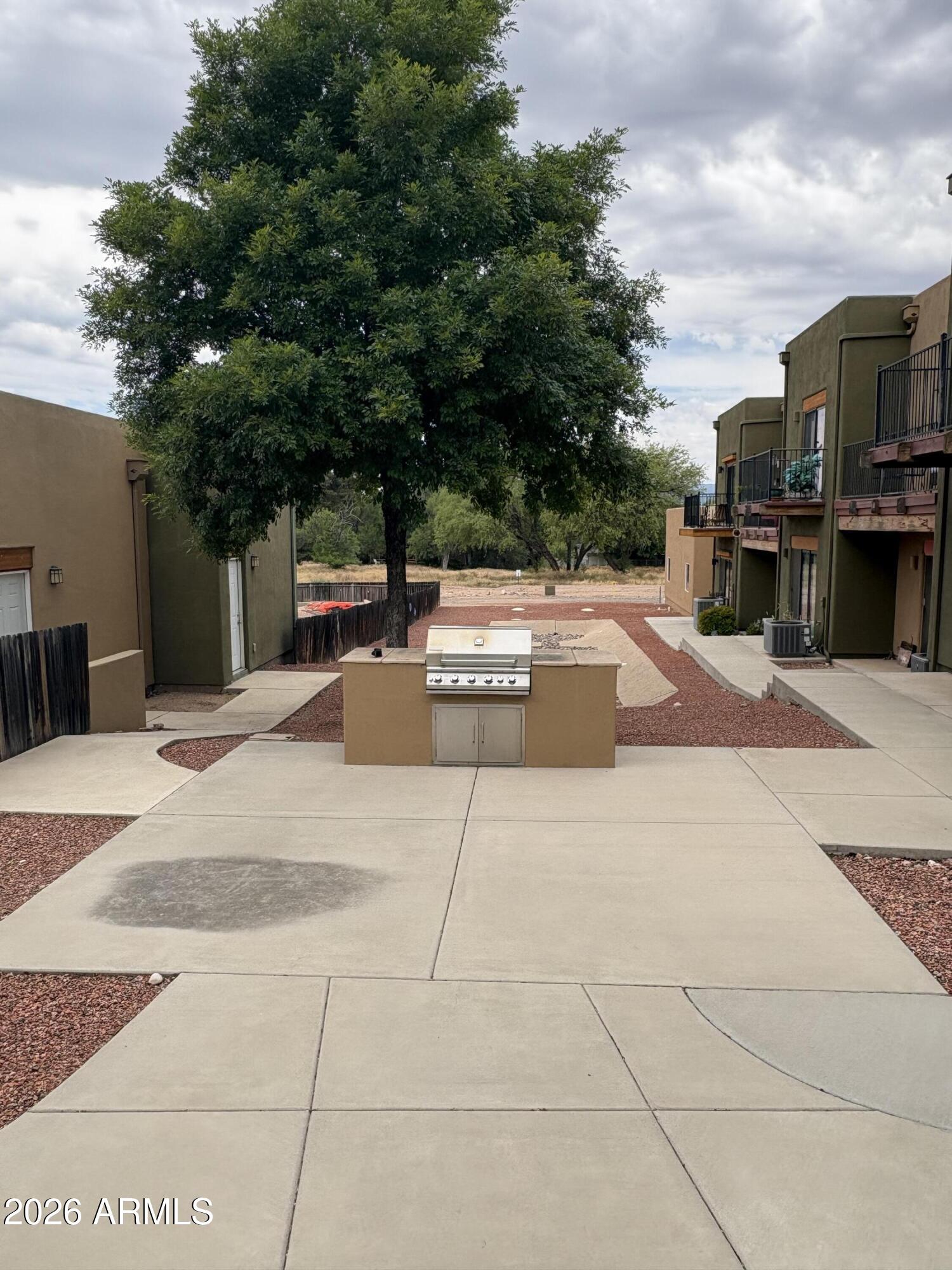 4210 North Montezuma Avenue, Unit 12 Rimrock, AZ 86335 - Photo 16 of 17 a swimming pool with outdoor seating and yard
