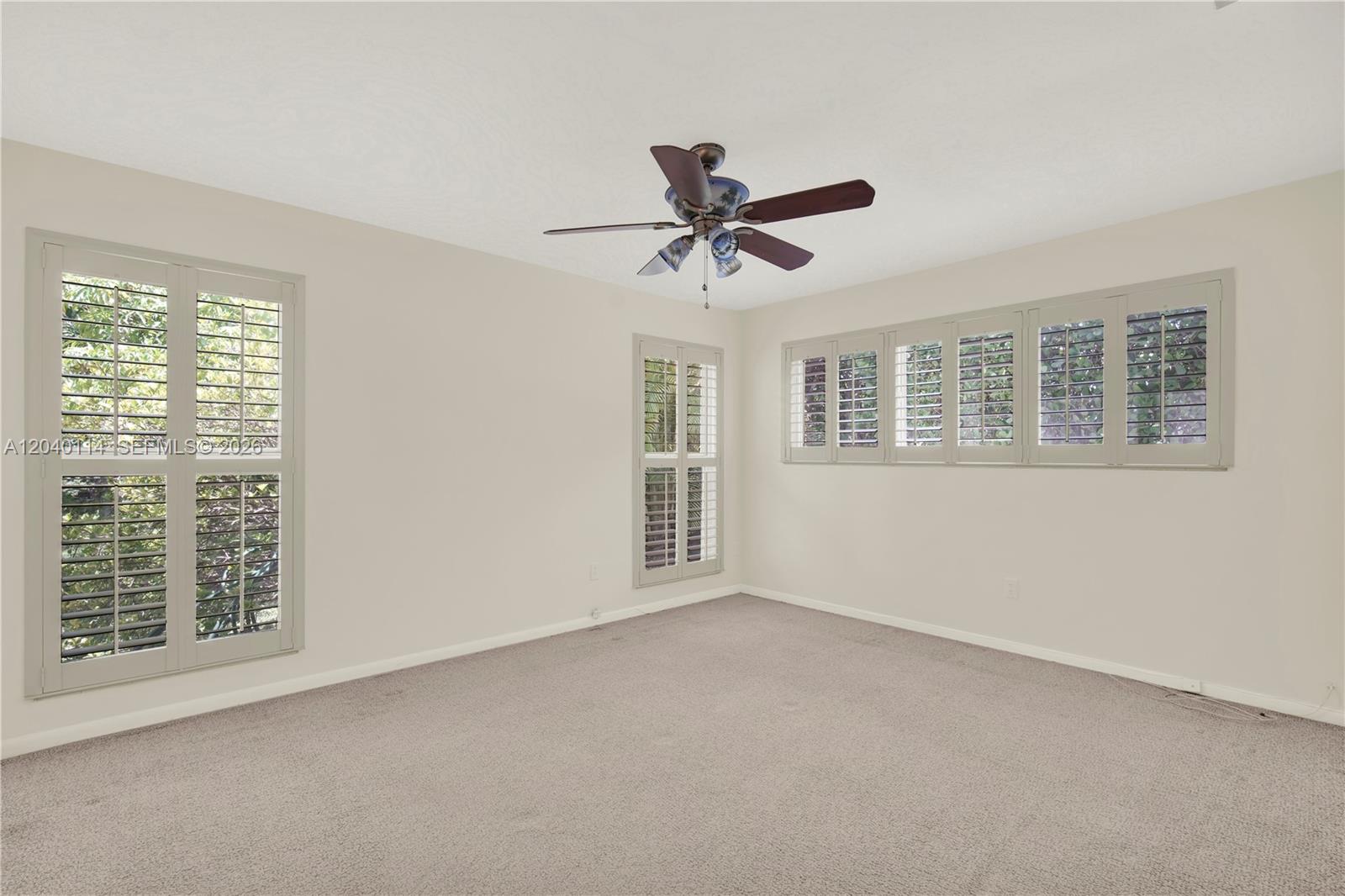 10435 Southwest 96th Street Miami, FL 33176 - Photo 22 of 44 Primary bedroom with terrazo flooring under the carpeting 15' x 12'