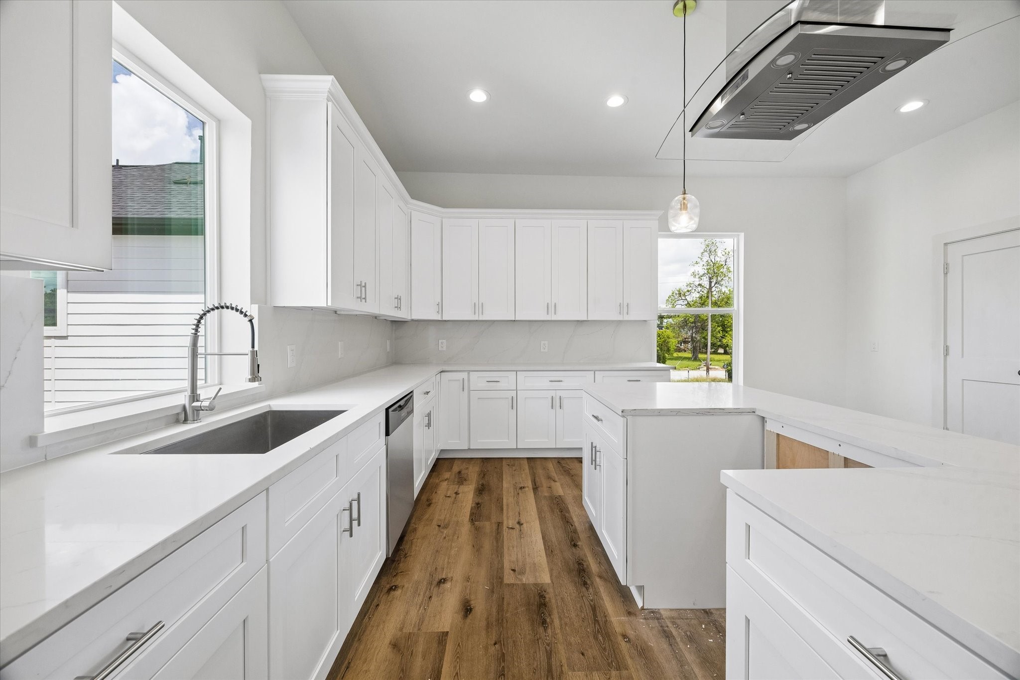 5508 Hardy Street Houston, TX 77009 - Photo 13 of 31 a kitchen with sink cabinets and window