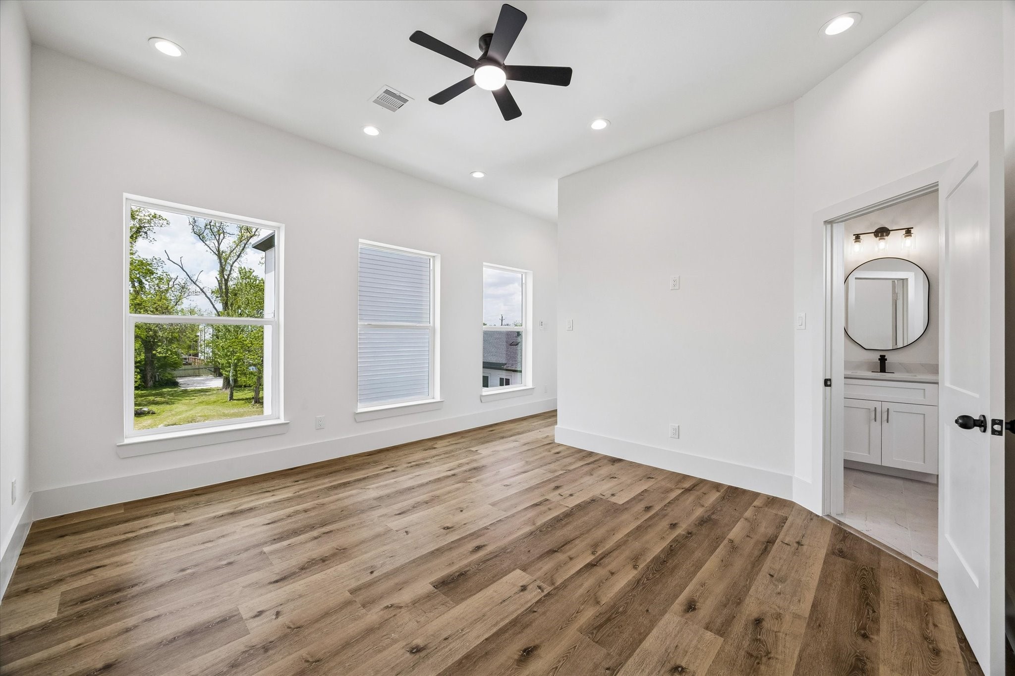 5508 Hardy Street Houston, TX 77009 - Photo 15 of 31 wooden floor in an empty room with a window