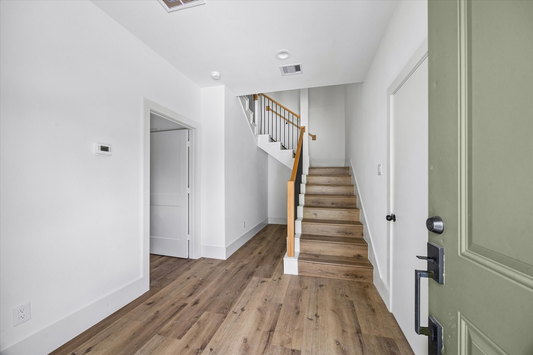 5508 Hardy Street Houston, TX 77009 - Photo 2 of 31 a view of a hallway with wooden floor and entryway