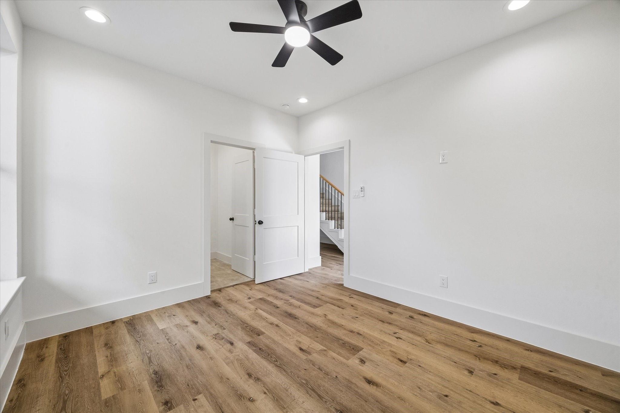 5508 Hardy Street Houston, TX 77009 - Photo 23 of 31 a view of empty room with wooden floor