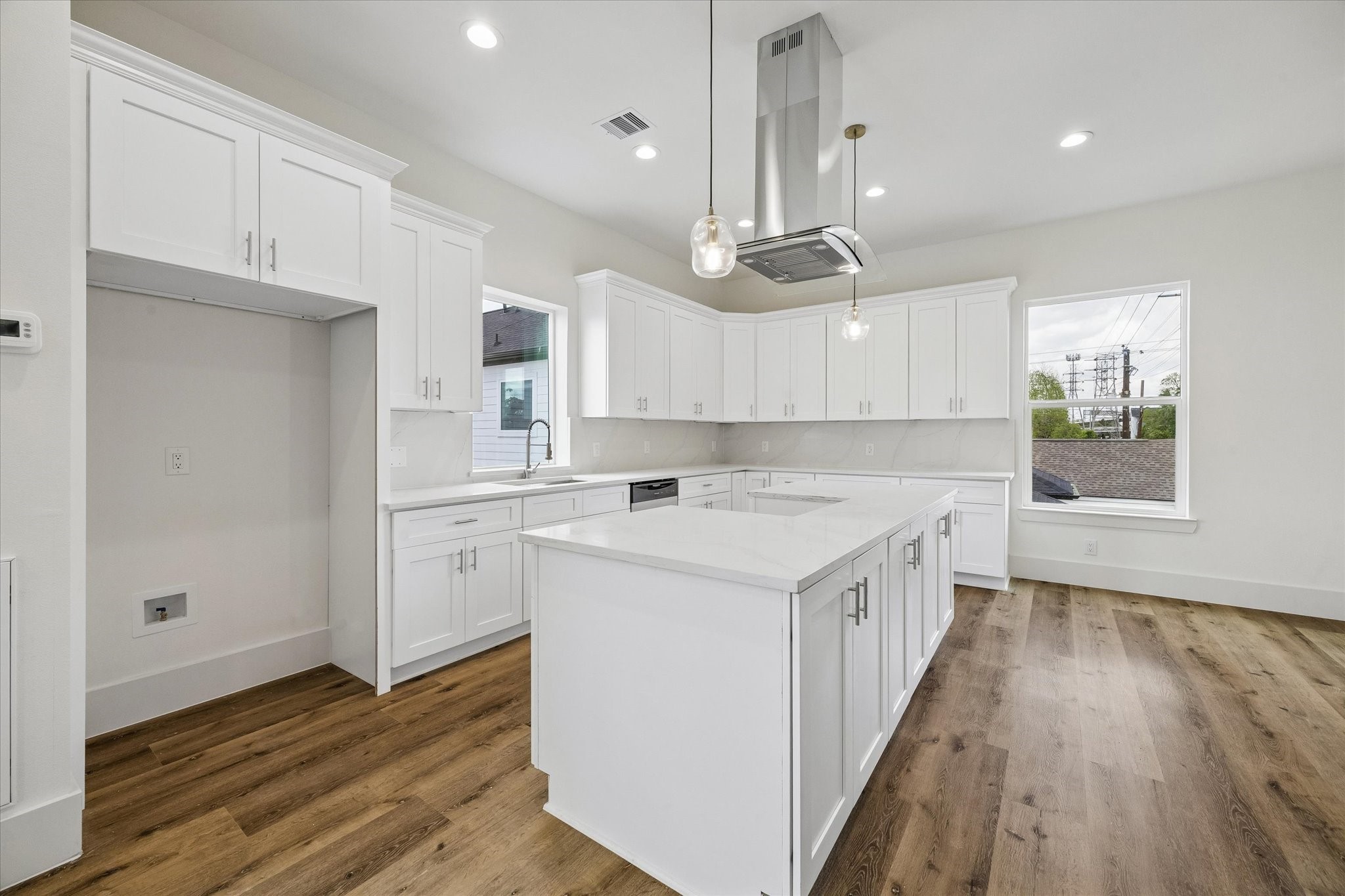 5508 Hardy Street Houston, TX 77009 - Photo 10 of 31 a kitchen with a sink a window stainless steel appliances and cabinets