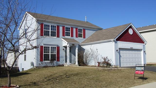 485 Rebecca Lane Bolingbrook, IL 60440 - Photo 1 of 16 a view of a white house with large windows and a small yard