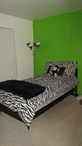 485 Rebecca Lane Bolingbrook, IL 60440 - Photo 14 of 16 a bed sitting in a bedroom next to a larger window