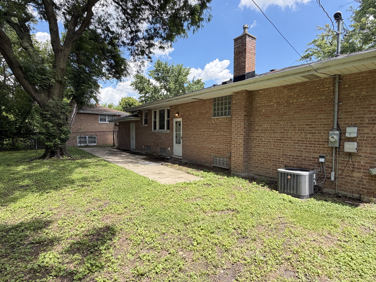 1820 169th Street Hazel Crest, IL 60429 - Photo 23 of 23 a backyard of a house with yard and tree