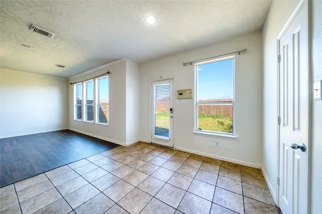 a view of an empty room and window