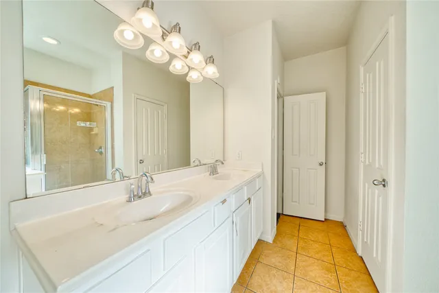 a bathroom with a sink a vanity and a mirror